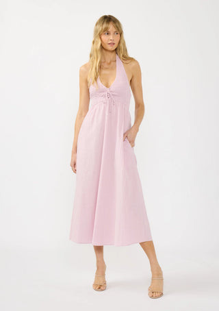 Woman wearing a pink dress on a white background