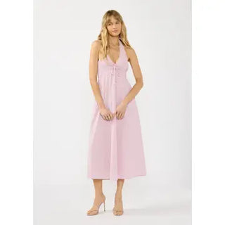 Woman wearing a pink dress on a white background