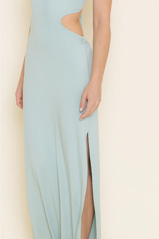 Light blue dress with a slit on a neutral background